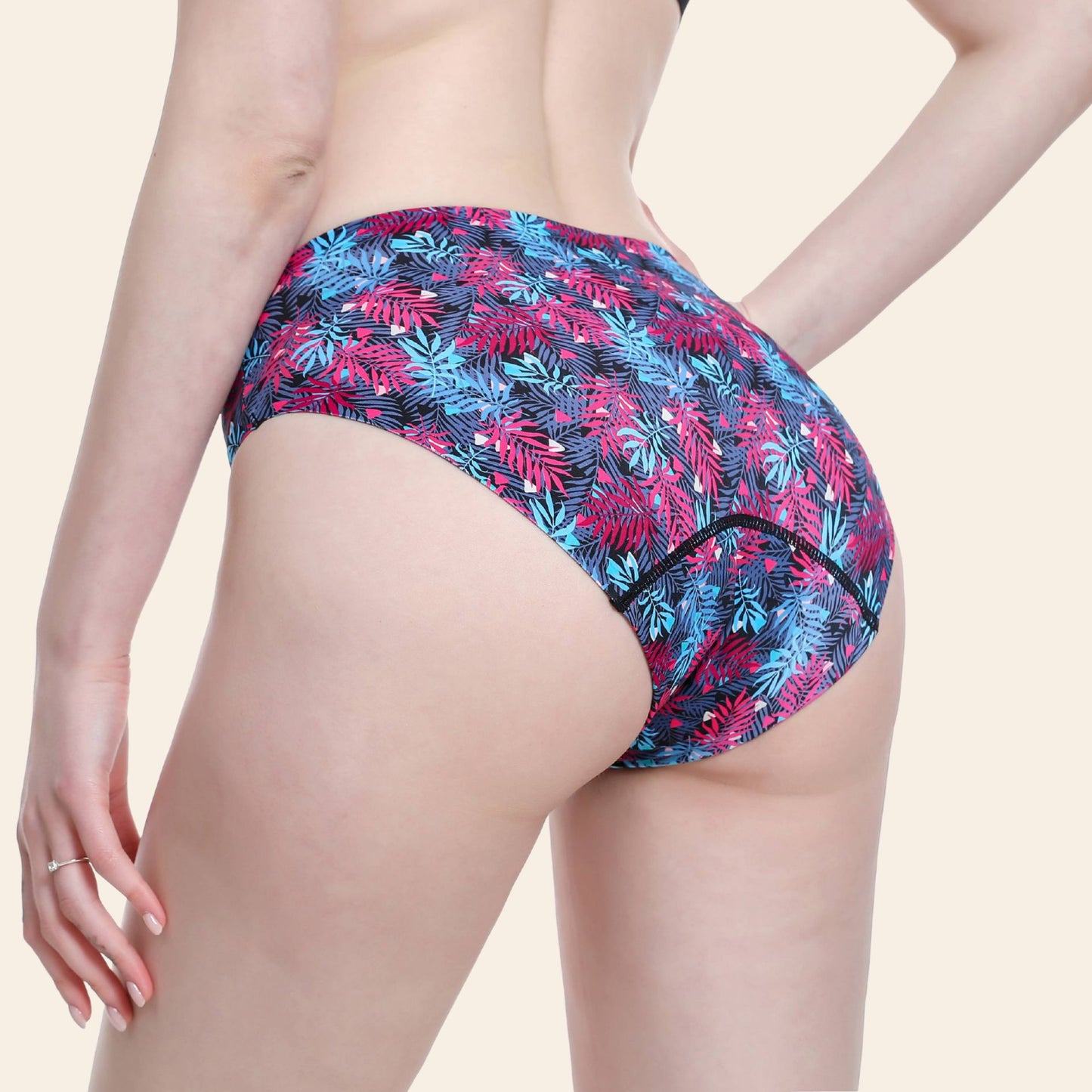Dos du maillot de bain de règles sans couture TabooPlus, motif tropical, coupe "seconde peau" et protection anti-fuite.