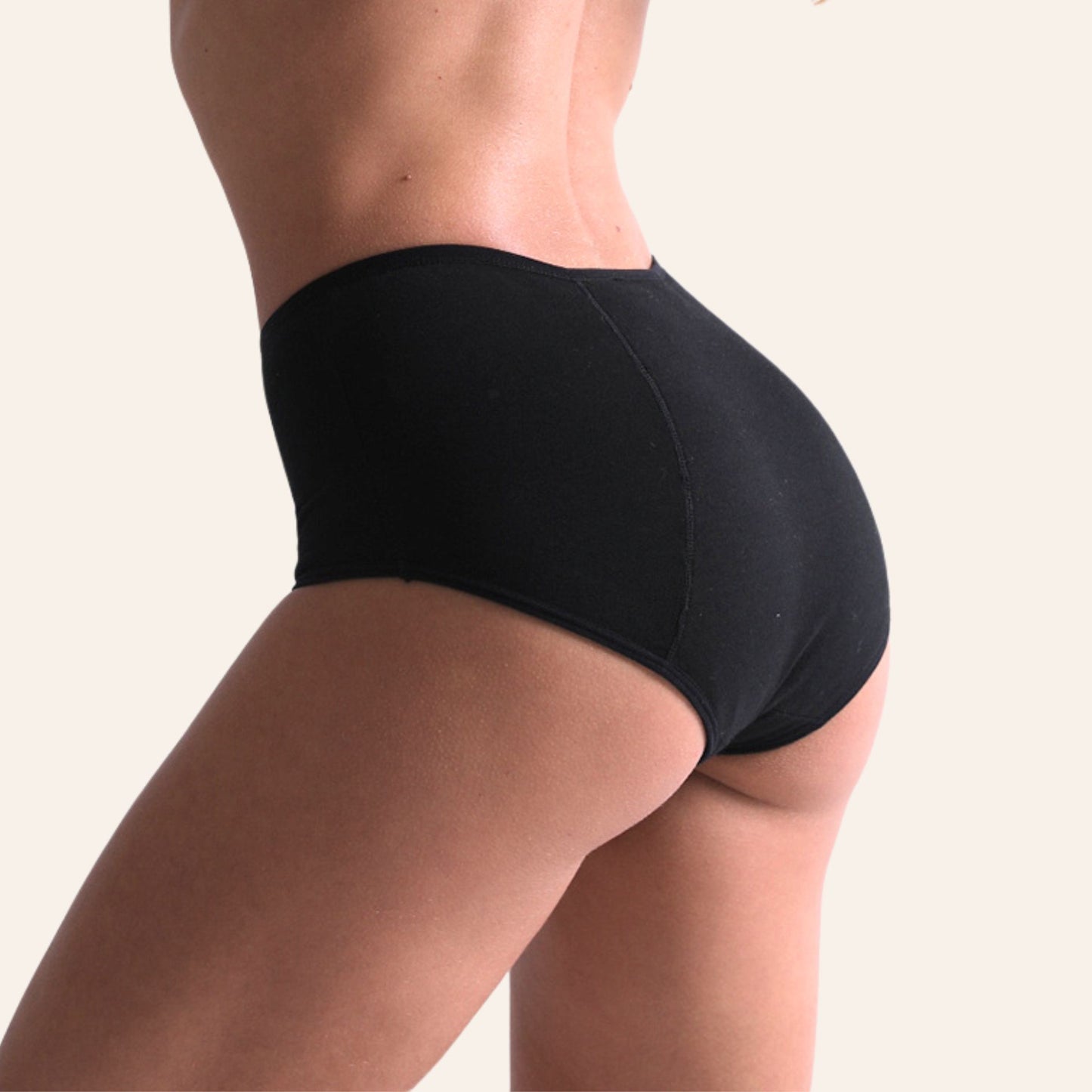Vue latérale du shorty de règles noir TabooPlus en bambou, souple et respirant pour une sensation "seconde peau".
