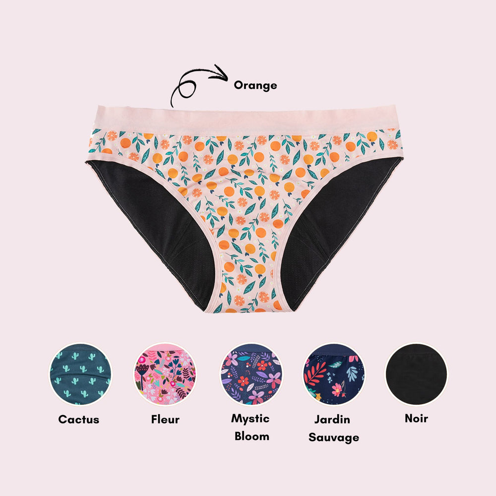 Vue produit à plat de la culotte en coton pour Ados, couleur nude pâle avec des motifs d'oranges (avec couleurs variantes montrées)